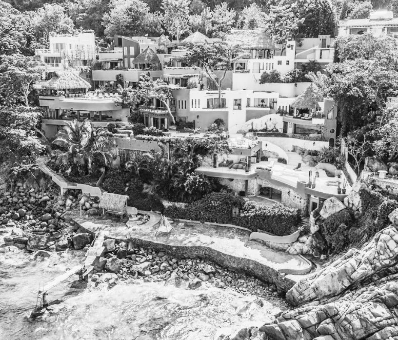 Aerial view of Villa Mandarinas terraces stepping down to the ocean in Mismaloya